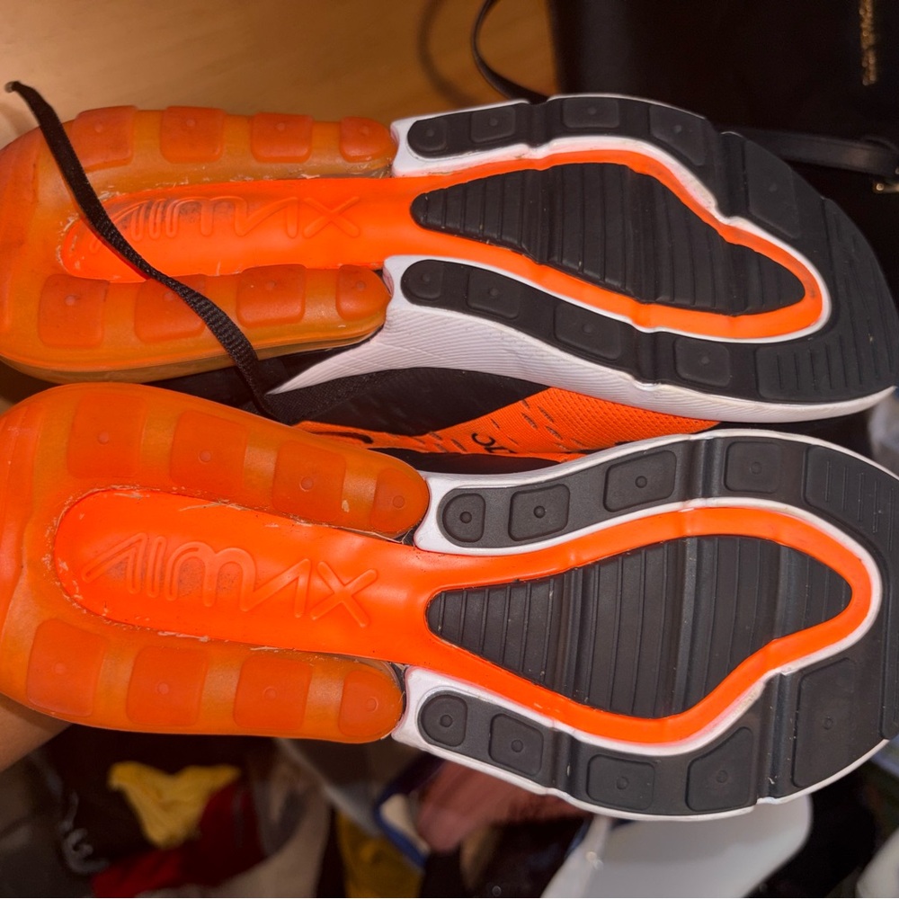 Nike Black and Orange Sneakers with Curved Design